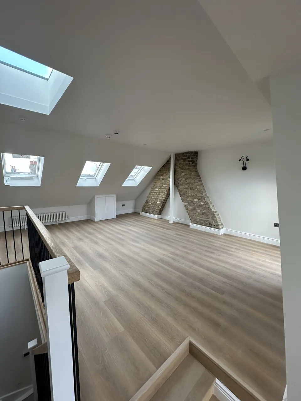 Exposed brick chimney breast: Flat Conversion with New Loft in White City by Alb Homes