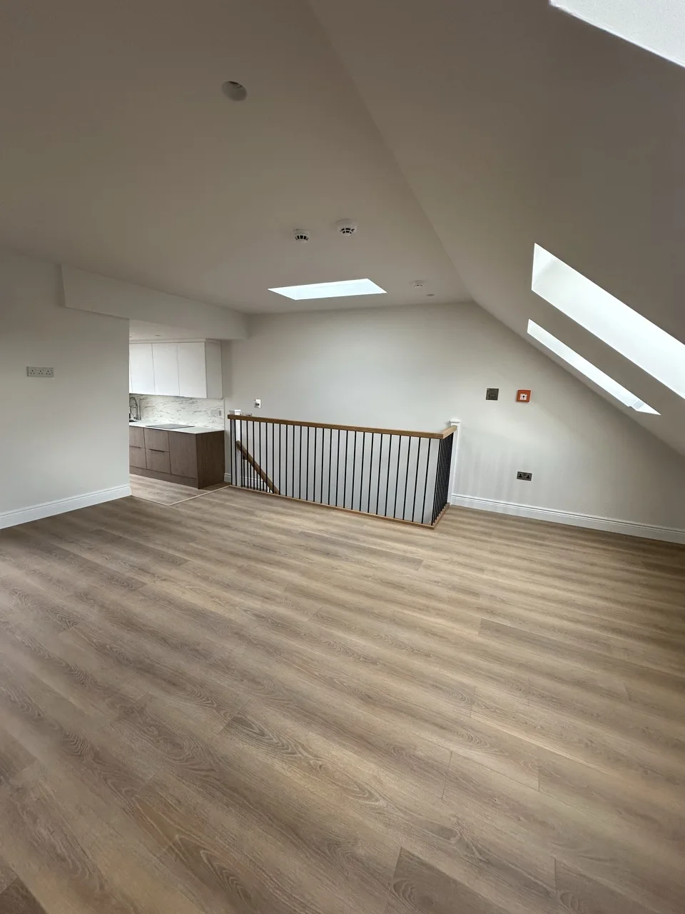 The loft, looking back to the kitchen: Flat Conversion with New Loft in White City by Alb Homes
