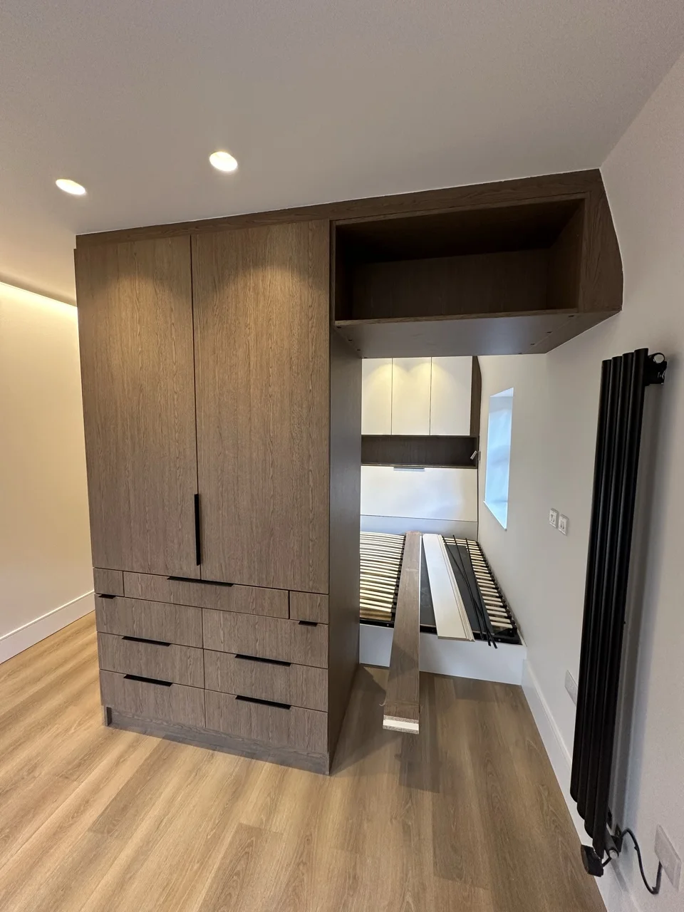 The studio's fold-down bed: Flat Conversion with New Loft in White City by Alb Homes
