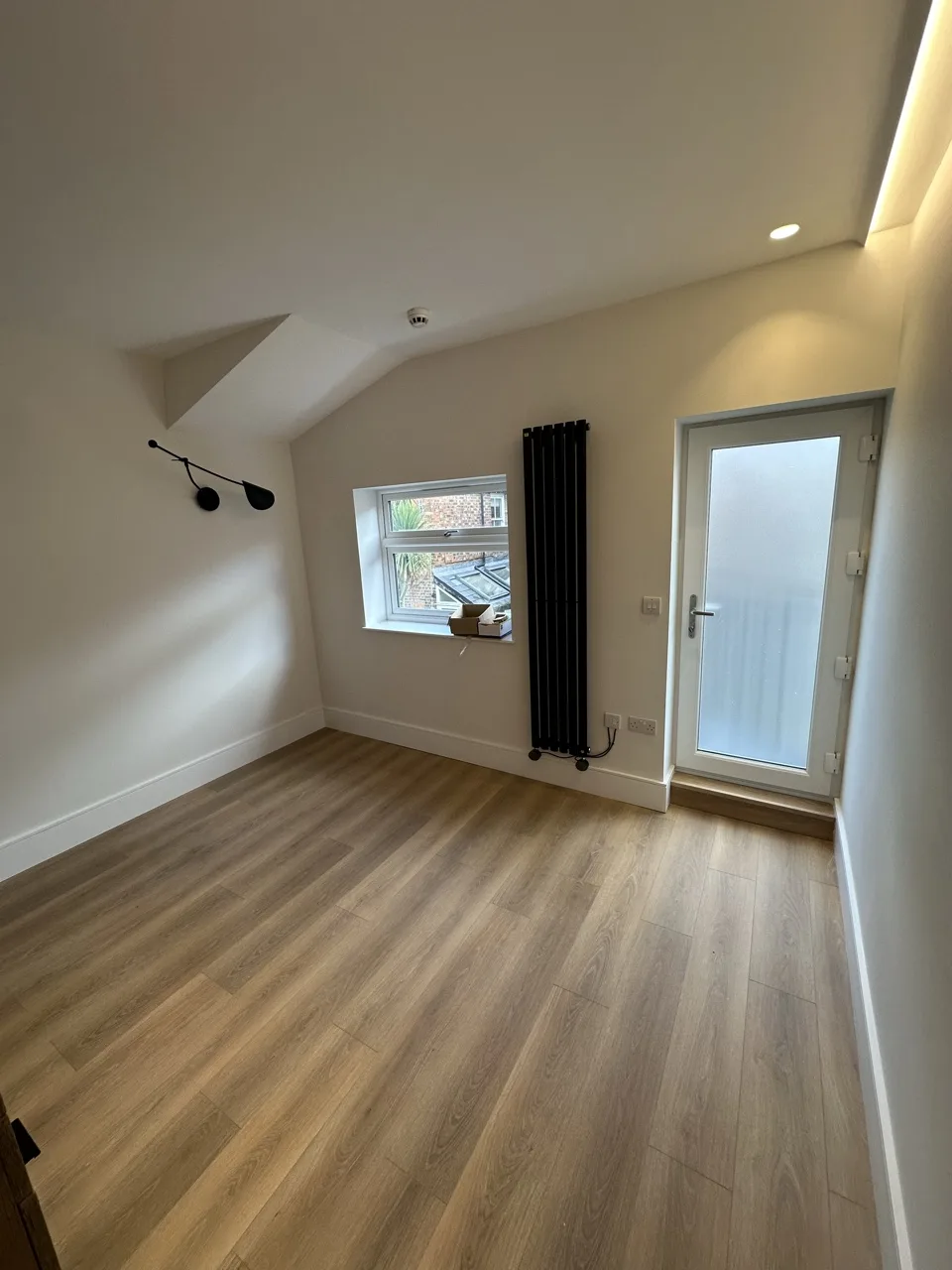 Back door to the spiral stair: Flat Conversion with New Loft in White City by Alb Homes