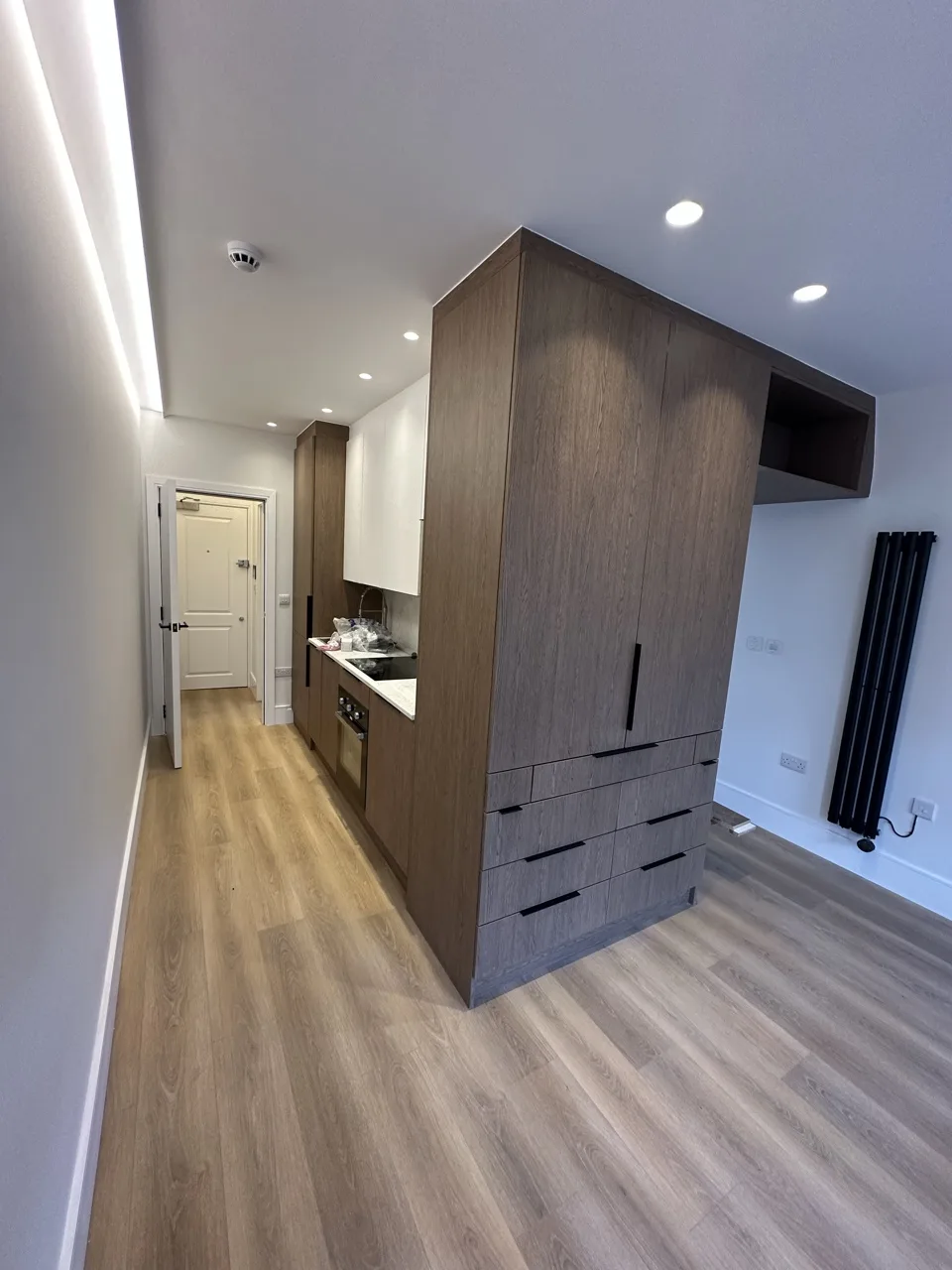 The studio, with its fitted wardrobe unit: Flat Conversion with New Loft in White City by Alb Homes